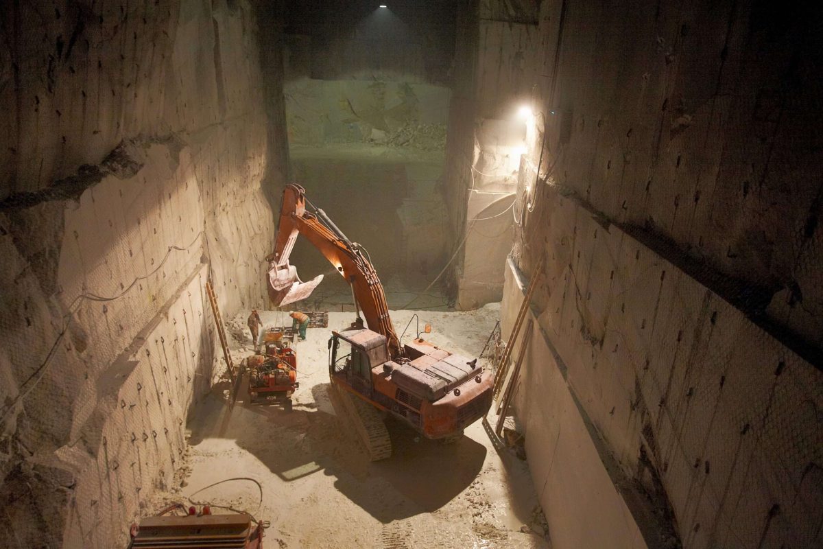Excavator in a marble quarry